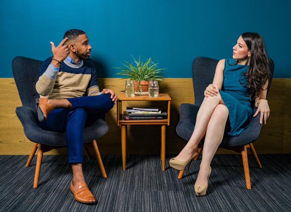 Couple talking on chairs